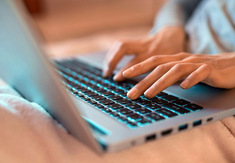 Typing on a laptop Typing on a laptop